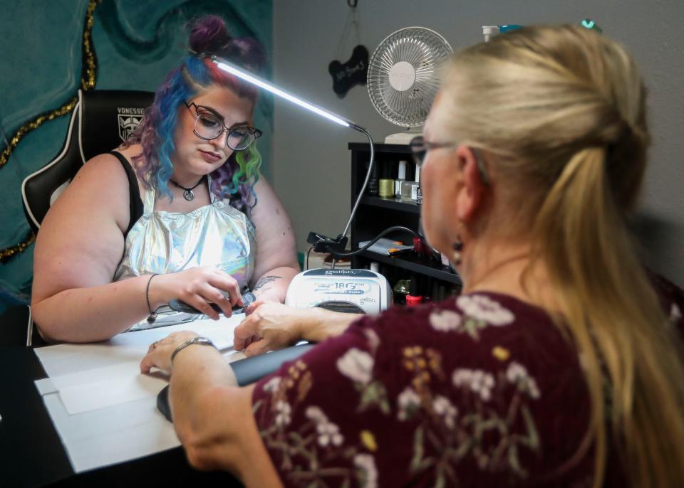 Kira Breu gives her mother-in-law, Leah Breu, a manicure on July 7 at Central Tranquility in Marshfield. Breu opened her business in May and offers manicures, pedicures, facials and full-body waxing.