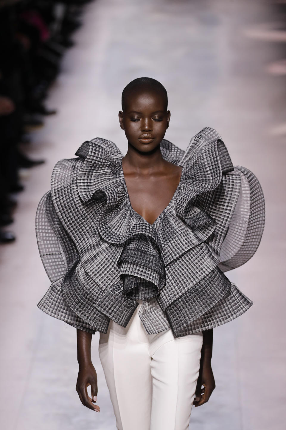 A model wears a creation for the Givenchy Haute Couture Spring/Summer 2020 fashion collection presented Tuesday Jan. 21, 2020 in Paris. (AP Photo/Christophe Ena)