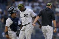 New York Yankees relief pitcher Aroldis Chapman (54) is relieved by manager Aaron Boone, right, in the ninth inning of a baseball game against the Chicago White Sox, Sunday, May 22, 2022, in New York. (AP Photo/John Minchillo)