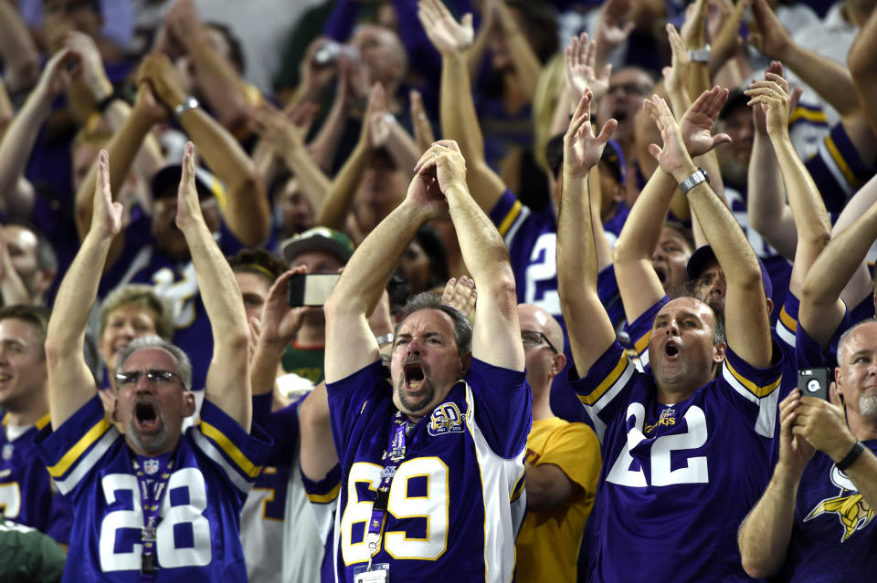 Vikings fans perform the “Skol” clap at the 2016 home opener – the game at which the chant was introduced. (Getty)