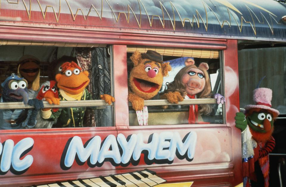 Gonzo (from left), Camilla, Scooter, Fozzie Bear, Miss Piggy and Dr. Teeth climb aboard the Electric Mayhem Bus in "The Muppet Movie."