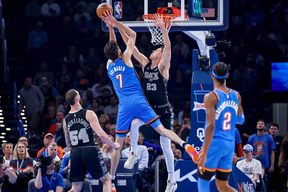 Oklahoma City forward Chet Holmgren (7) jumps to shoot over San Antonio forward Zach Collins (23) in the first quarter during an NBA game between The Oklahoma City Thunder and The San Antonio Spurs at the Paycom Center in Oklahoma City, on Wednesday, April 10, 2024.
