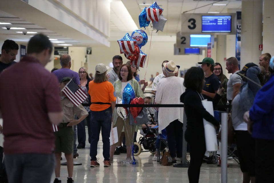 People wait for arriving passengers at Midway International Airport in Chicago Wednesday, July 12, 2023. A tornado touched down Wednesday evening near Chicago’s O’Hare International Airport, prompting passengers to take shelter and disrupting hundreds of flights. (AP Photo/Nam Y. Huh)