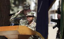 A U.S. Army soldier sings a song during the change of command ceremony at Resolute Support headquarters, in Kabul, Afghanistan, Sunday, Sept. 2, 2018. U.S. Army Gen. Austin Miller has assumed command of the 41-nation NATO mission in Afghanistan following a handover ceremony. (AP Photo/Massoud Hossaini)