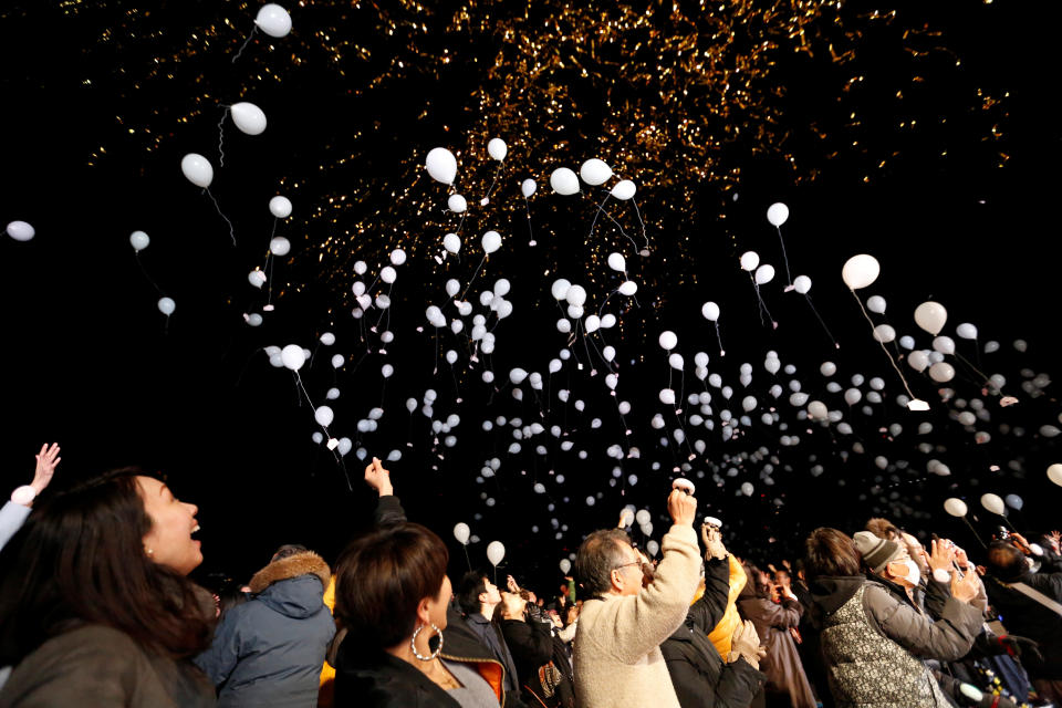 People release balloons as they take part in a New Year's countdown event in Tokyo, Japan on January 1, 2018. (Photo: Toru Hanai / Reuters)