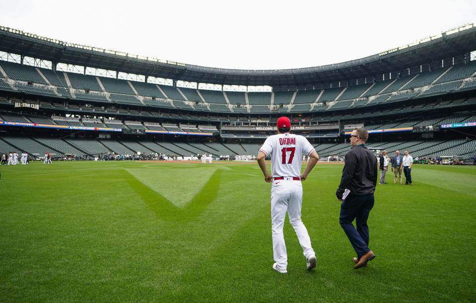 American League's Shohei Ohtani, of the Los Angeles Angels, walks back to the outfield after the All-Star Game player availability, Monday, July 10, 2023, in Seattle. The All-Star Game will be played Tuesday, July 11. (AP Photo/Lindsey Wasson)