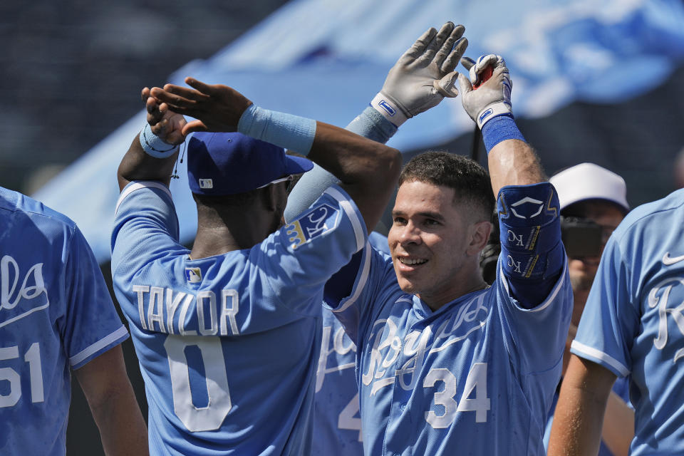 Kansas City Royals' Freddy Fermin (34) celebrates with teammates after hitting a two-run double to win the baseball game during the tenth inning Thursday, June 29, 2023, in Kansas City, Mo. The Royals won 3-2 in ten innings. (AP Photo/Charlie Riedel)