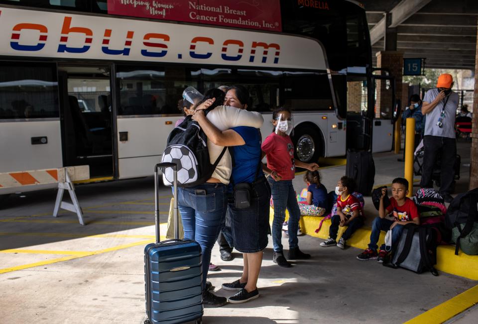 A Honduran asylum seeker, left, embraces a church member upon arrival to the United States on February 26, 2021. Her group of immigrants was one of the first to cross into south Texas as part of the Biden administration's unwinding of the Trump-era 'Remain in Mexico' immigration policy. The government officially ended the program earlier this month.