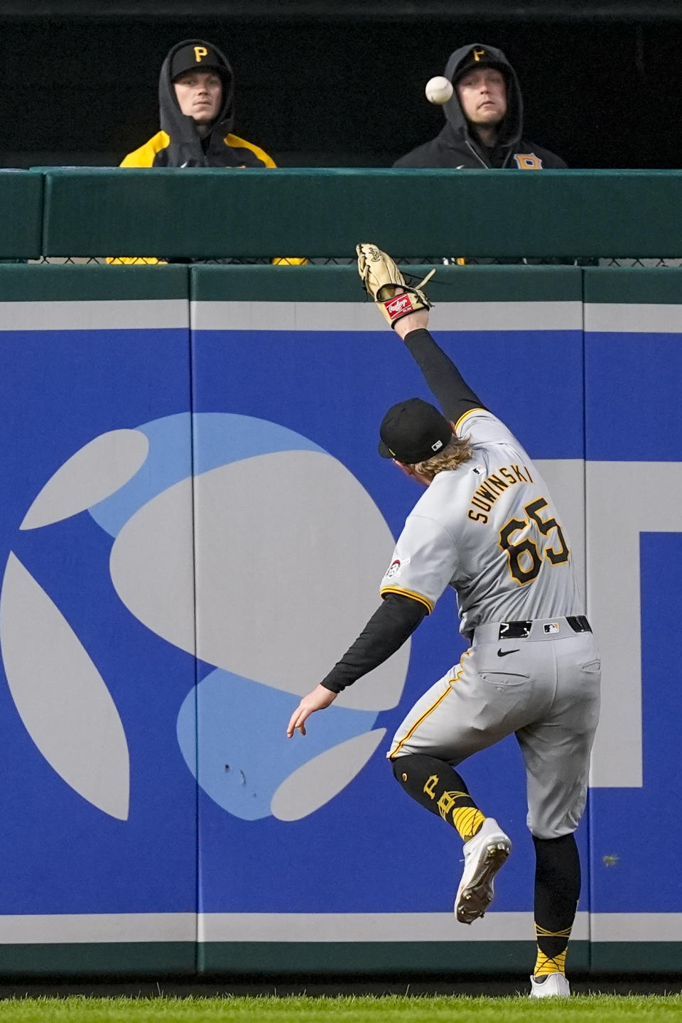 Pittsburgh Pirates left fielder Jack Suwinski runs to grab a ball hit by Washington Nationals' Trey Lipscomb during the second inning of a baseball game at Nationals Park, Wednesday, April 3, 2024, in Washington. (AP Photo/Alex Brandon)