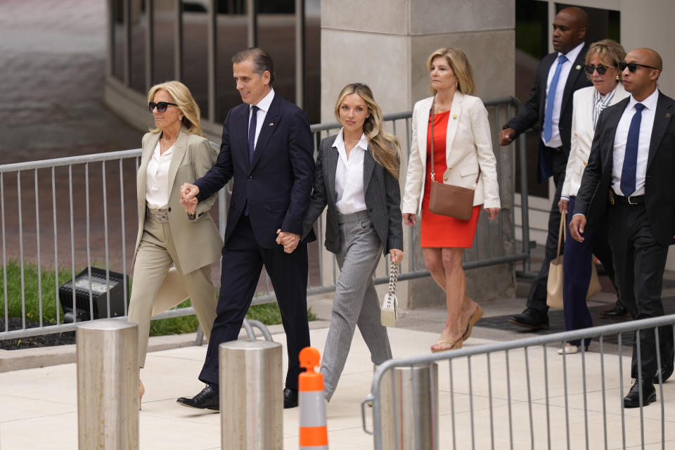 Hunter Biden, President Joe Biden's son, accompanied by his mother, first lady Jill Biden and his wife, Melissa Cohen Biden, walks out of federal court after hearing the verdict, Tuesday, June 11, 2024, in Wilmington, Del. Hunter Biden has been convicted of all 3 felony charges in the federal gun trial. (AP Photo/Matt Slocum)