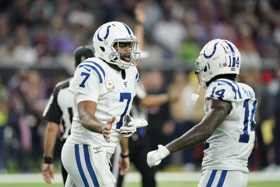 Indianapolis Colts quarterback Jacoby Brissett (7) celebrates with teammate Zach Pascal (14) after a touchdown against the Houston Texans during the first half of an NFL football game Thursday, Nov. 21, 2019, in Houston. (AP Photo/David J. Phillip)