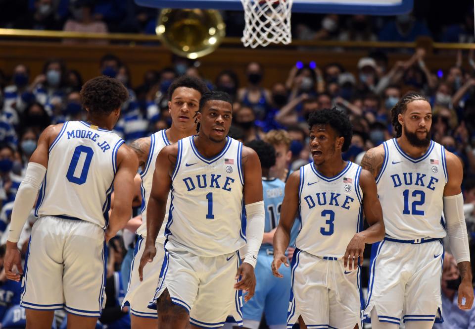 Nov 22, 2021; Durham, North Carolina, USA;  Duke Blue Devils forward Wendell Moore Jr. (0) forward Paolo Banchero (5)  guard Trevor Keels (1)  guard Jeremy Roach (3) and forward Theo John (12) leave the court during a timeout in the first half against The Citadel Bulldogs at Cameron Indoor Stadium. Mandatory Credit: Rob Kinnan-USA TODAY Sports