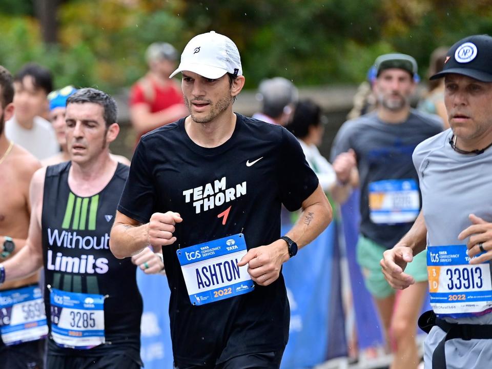 Ashton Kutcher running the New York City Marathon in November 2022