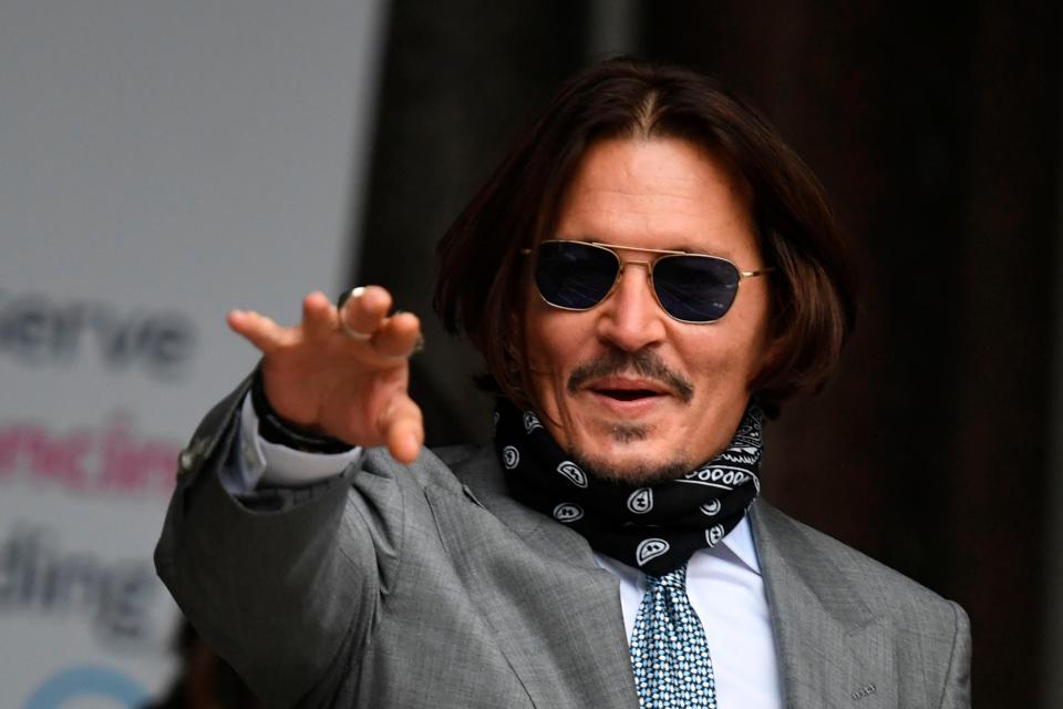 Johnny Depp arrives on day eight of his libel trial against The Sun tabloid in London on July 16, 2020.