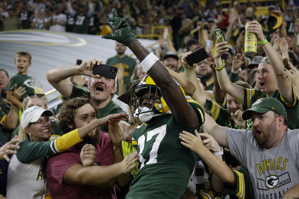 Green Bay Packers wide receiver Romeo Doubs (87) celebrates his touchdown reception during the first half of a preseason NFL football game against the New Orleans Saints Friday, Aug. 19, 2022, in Green Bay, Wis. (AP Photo/Matt Ludtke)