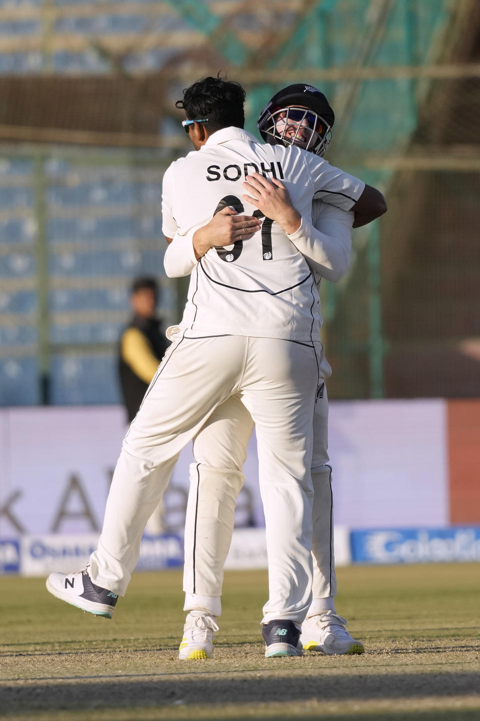 New Zealand's Ish Sodhi celebrates with teammate after taking the wicket of Pakistan's Shan Masood during the fourth day of first test cricket match between Pakistan and New Zealand, in Karachi, Pakistan, Thursday, Dec. 29, 2022. (AP Photo/Fareed Khan)