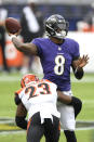 Cincinnati Bengals cornerback Darius Phillips (23) applies a hit as Baltimore Ravens quarterback Lamar Jackson (8) throws a pass during the first half of an NFL football game, Sunday, Oct. 11, 2020, in Baltimore. (AP Photo/Nick Wass)