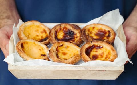 These custard tarts are probably reason enough to pay Portugal a visit - Credit: AP/FOTOLIA