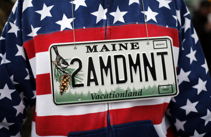<p>Rocky Habeeb of Bangor, Maine wears a vanity license plate that will go on his new car while attending a gun rights rally, Saturday, April 14, 2018, at the State House in Augusta, Maine. (Photo: Robert F. Bukaty/AP) </p>