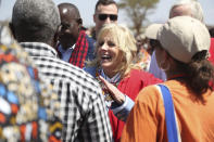 US First Lady Jill Biden, middle, talks to women from the Maasai community as they explain the drought situation in Ngatataek, Kajiado Central, Kenya, Sunday, Feb. 26, 2023. Biden is in Kenya on the second and final stop of her trip. (AP Photo/Brian Inganga)