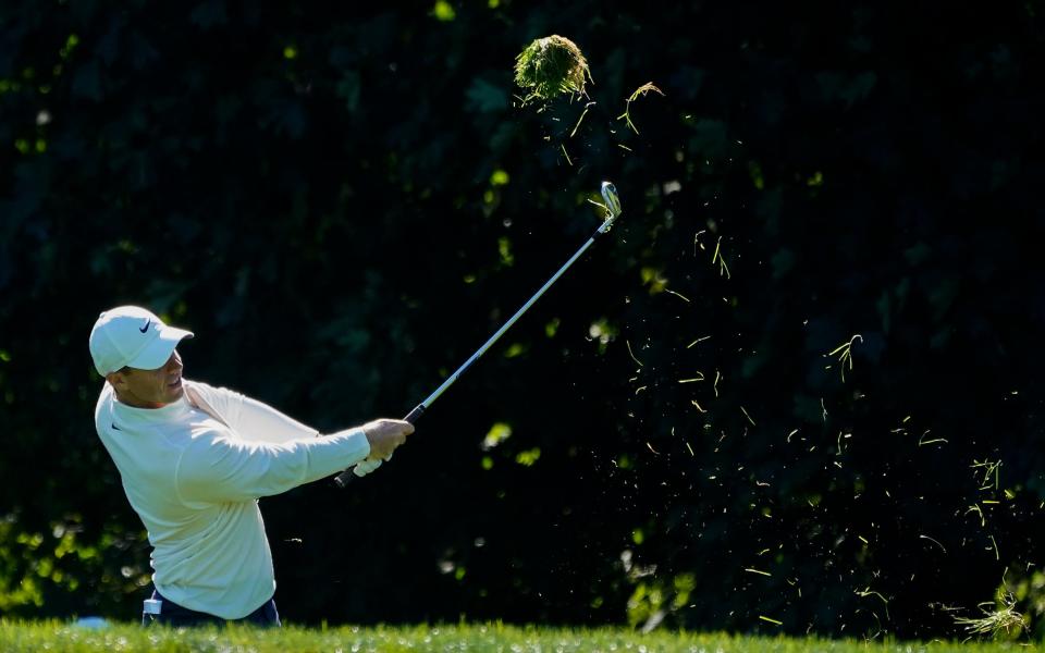 Rory McIlroy, of Northern Ireland, hits out of the rough on the 14th hole during the third round of the US Open - AP