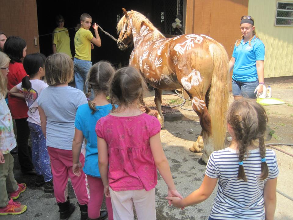 Children with a horse at the Carriage Barn