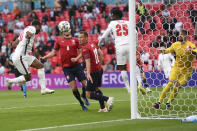 England's Raheem Sterling, left, scores his side's opening goal during the Euro 2020 soccer championship group D match between Czech Republic and England, at Wembley stadium in London, Tuesday, June 22, 2021. (AP Photo/Laurence Griffiths, Pool)