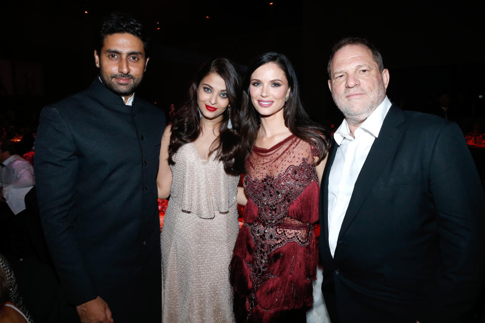 Aishwarya Rai’s actor husband, Abhishek Bachchan, and Rai pose with Georgina Chapman and Harvey Weinstein at amfAR’s gala during the Cannes Film Festival in 2014. (Photo: Bertrand Rindoff Petroff/amfAR14/WireImage)