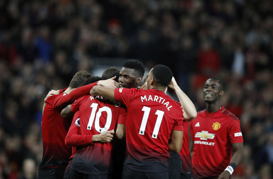 Manchester United’s Paul Pogba (centre) celebrates with teammates after scoring his side’s first goal of the game against Bournemouth on 30 December, 2018. (PHOTO: Martin Rickett/PA via AP)