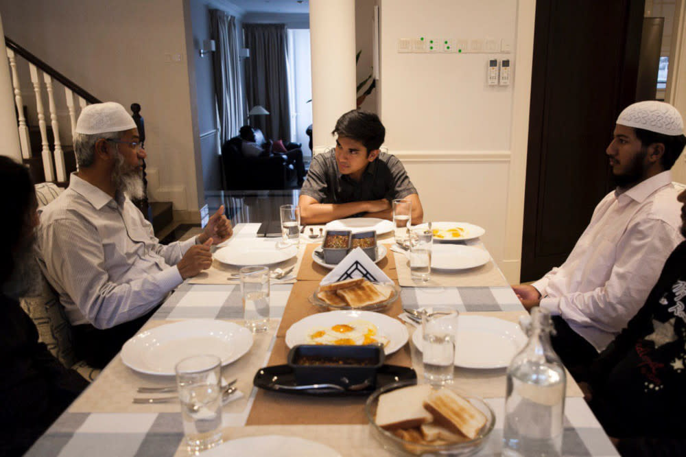 Youth and Sports Minister Syed Saddiq Abdul Rahman having dinner with Dr Zakir Naik August 24, 2019. — Picture from Twitter/SyedSaddiq