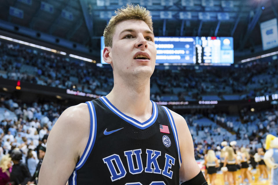 Duke center Kyle Filipowski walks off the court after the team's win over North Carolina in an NCAA college basketball game Saturday, March 4, 2023, in Chapel Hill, N.C. (AP Photo/Jacob Kupferman)