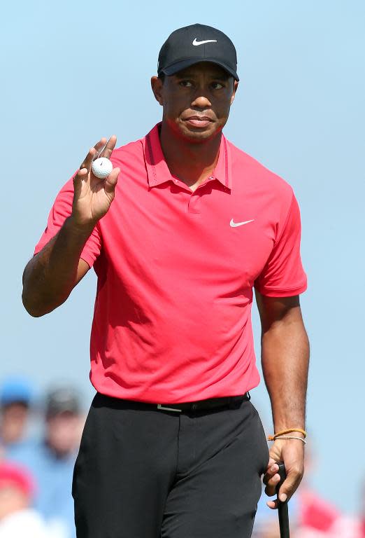 US golfer Tiger Woods after making a par putt on the 6th green during his fourth round, on the final day of the 2014 British Open Golf Championship in Hoylake, England, July 20, 2014