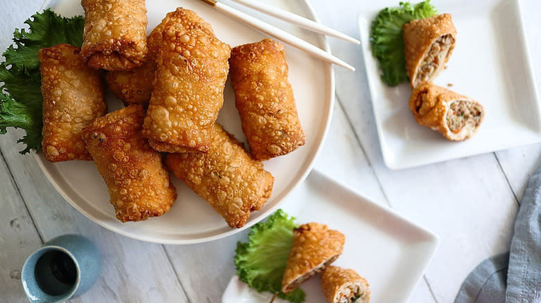 Egg rolls on white plate