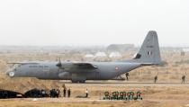 <p>Indian Air Force(IAF)”Garuda” commandos descend from a transport aircraft during IAF Exercise Iron Fist 2016 at Pokhran in the western Indian state of Rajasthan on March 18, 2016. </p>