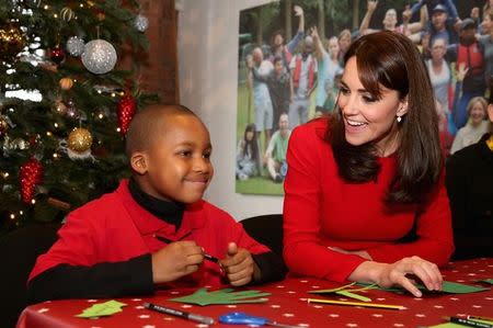 Britain's Catherine, Duchess of Cambridge takes part in group activities as she attends the Anna Freud Centre Family School Christmas Party at Anna Freud Centre, in London, December 15, 2015. REUTERS/Chris Jackson/Pool/Files