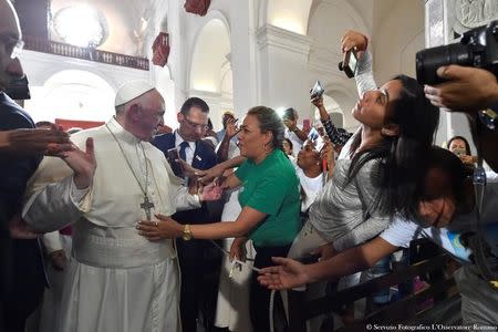 Pope Francis is greeted by faithful during a visit to the Sanctuary of St. Peter Claver, Cartagena, Colombia, 10 September 2017. Osservatore Romano/Handout via REUTERS ATTENTION EDITORS - THIS IMAGE WAS PROVIDED BY A THIRD PARTY. NO RESALES. NO ARCHIVE