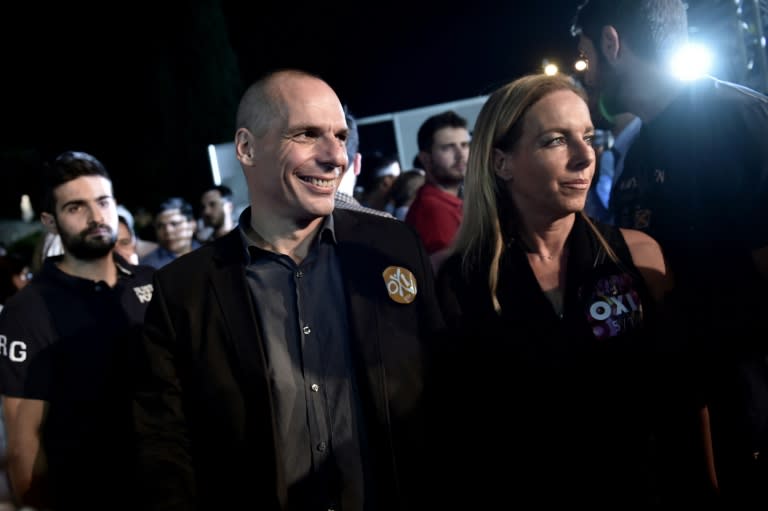 Greek Finance Minister Yanis Varoufakis and his wife Danae attend an address by the Greek prime minister in downtown Athens on July 3, 2015