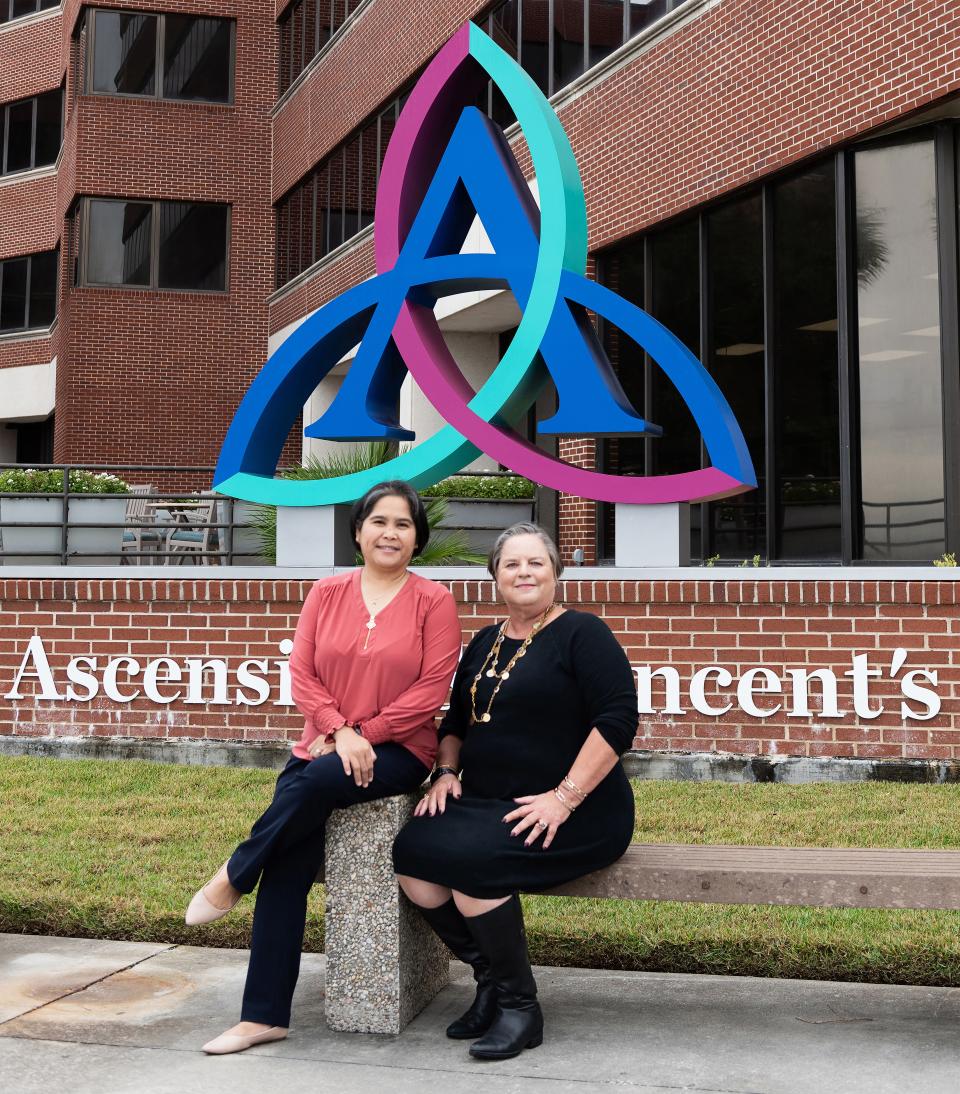 Registered nurse Ruby Soriano (left), manager of Ascension St. Vincent's Riverside's oncology support services program, sits outside the hospital with Jacksonville philanthropist Andrea Laliberte, who provided the initial funding for the program.