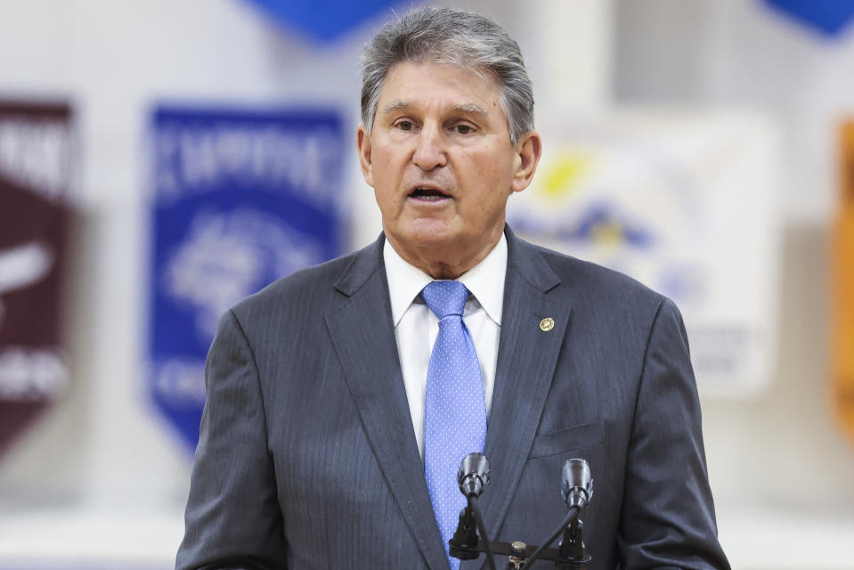 FILE - In this May 13, 2021, file photo, Sen. Joe Manchin, D-W.Va., speaks during a visit with first lady Jill Biden to a vaccination center at Capital High School in Charleston, W.Va. The two senators from West Virginia are playing central roles in President Joe Biden's infrastructure plans. Democrat Joe Manchin is a crucial 50th vote for his party on Biden's proposals.(Oliver Contreras/The New York Times via AP, Pool)