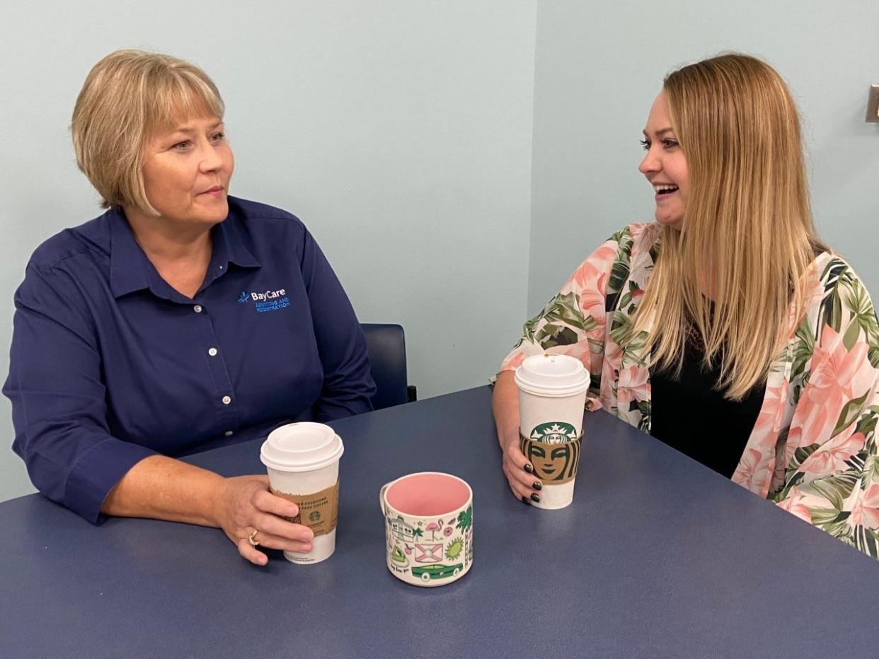 Jordan Watson, registered dietitian, right, discusses the benefits and drawbacks of coffee for heart health. With her is Laurie Goble  who does registration at Bartow Regional Medical Center.