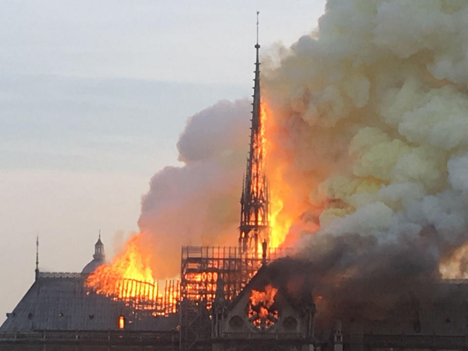 The spire at Notre Dame burns before collapsing (Picture: PA)