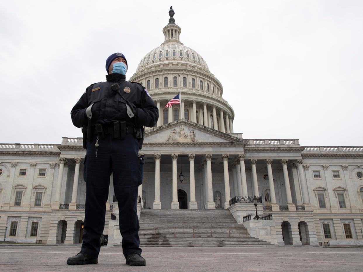 <p>A Capitol Police officer stands at the East Front of the US Capitol</p> ((EPA))