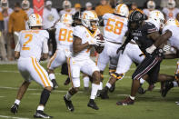 Tennessee wide receiver Velus Jones Jr. (1) takes a handoff from quarterback Jarrett Guarantano (2) during the first half of the team's NCAA college football game against South Carolina on Saturday, Sept. 26, 2020, in Columbia, S.C. (AP Photo/Sean Rayford)