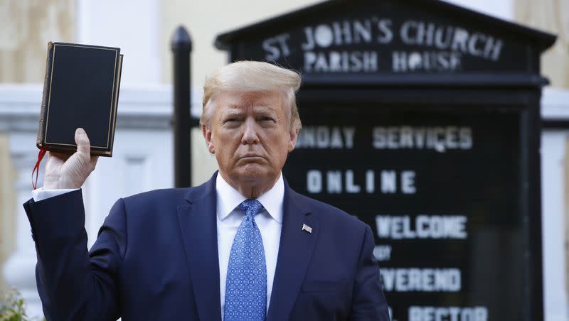 President Donald Trump holds a Bible as he visits outside St. John’s Church across Lafayette Park from the White House in this June 1, 2020, file photo. 