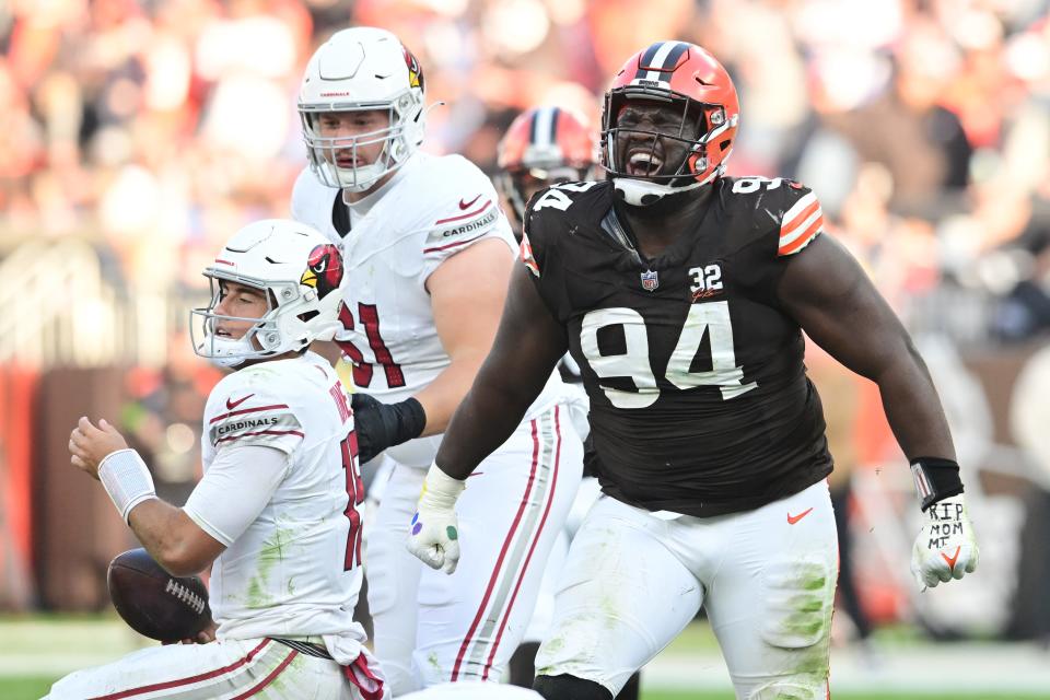 Cleveland Browns defensive tackle Dalvin Tomlinson (94) celebrates after sacking Arizona Cardinals quarterback Clayton Tune (15) on Sunday in Cleveland.