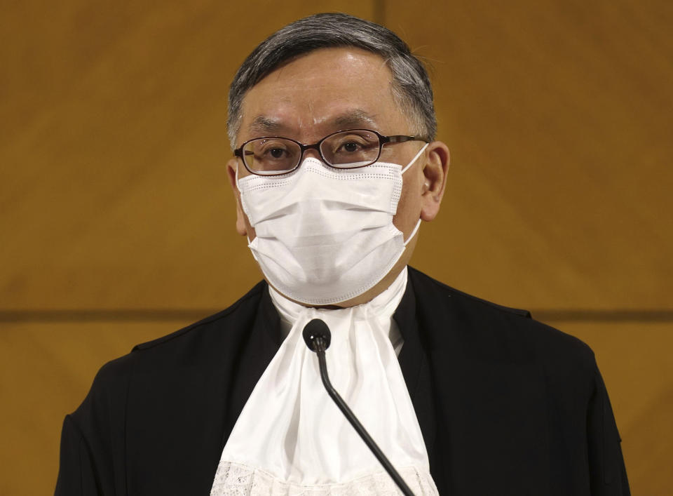 New Hong Kong's Chief Justice Andrew Cheung listens to reporters questions during a press conference in Hong Kong Monday, Jan. 11, 2021. Hong Kong's new top judge on Monday warned the territory's courts need to show they are impartial amid a flurry of politically charged cases or risk losing public trust. (AP Photo/Vincent Yu)