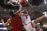 Eastern Washington's Rylan Bergersen (11) fouls Texas Tech's Kevin Obanor (0) while rebounding the ball during the first half of an NCAA college basketball game on Wednesday, Dec. 22, 2021, in Lubbock, Texas. (AP Photo/Brad Tollefson)