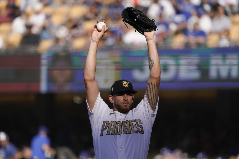 FILE - National League pitcher Joe Musgrove of the San Diego Padres, prepares to throw a pitch to the American League during the third inning of the MLB All-Star baseball game, on July 19, 2022, in Los Angeles. Joe Musgrove took a moment away from the mayhem of the champagne and beer-soaked clubhouse celebration after the San Diego Padres clinched a playoff spot to reflect on where his career has been and where he wants it to go. (AP Photo/Mark J. Terrill, File)