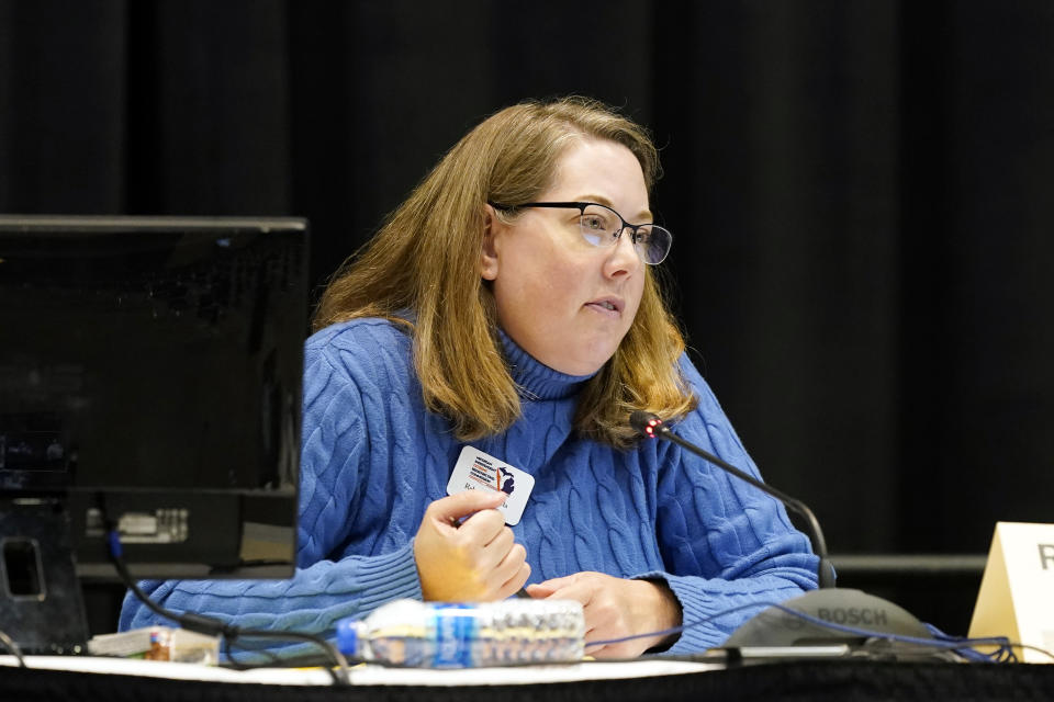 Attorney Rebecca Szetela who describes herself as an independent, chairs Michigan's new Independent Citizens Redistricting Commission on Oct. 21, 2021, in Lansing, Mich. The job of the commission is to redraw the lines of legislative seats to promote more partisan competition in a state where Republicans have dominated the Legislature for decades. One of the best ways to do that, and empower minority voters, Szetela and other commissioners argue, is putting some of the majority-Black neighborhoods in other districts, where they may have more say over Michigan's leadership. (AP Photo/Carlos Osorio)