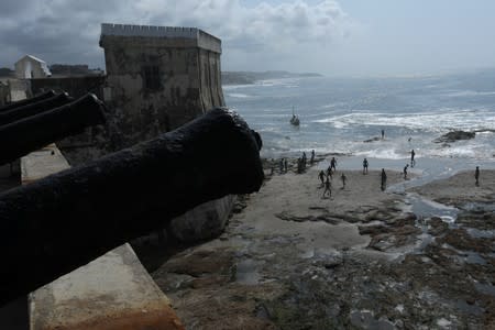 People play football as seen from the Cape Coast Castle